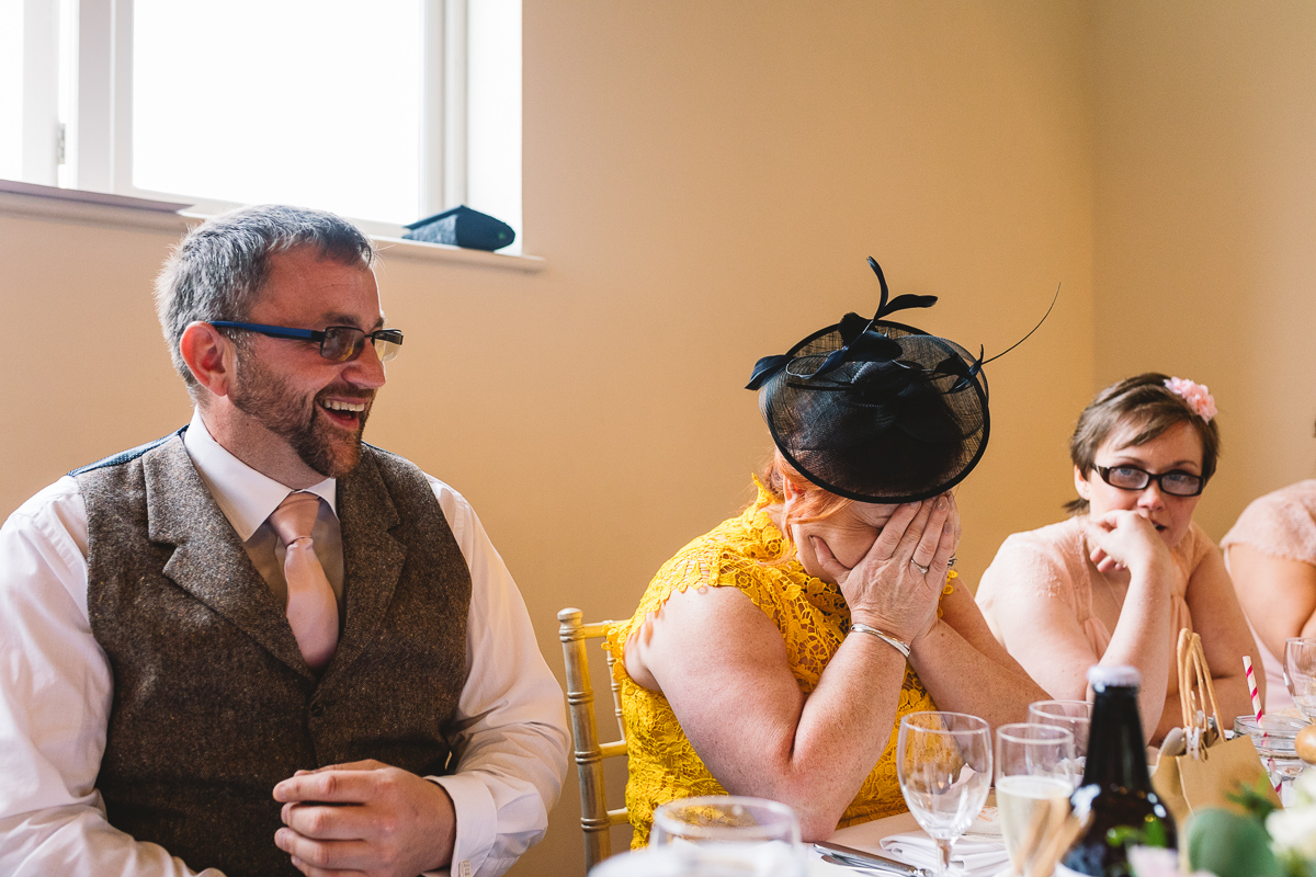Mother of the bride puts head in hands at hilarious and fun best man speech