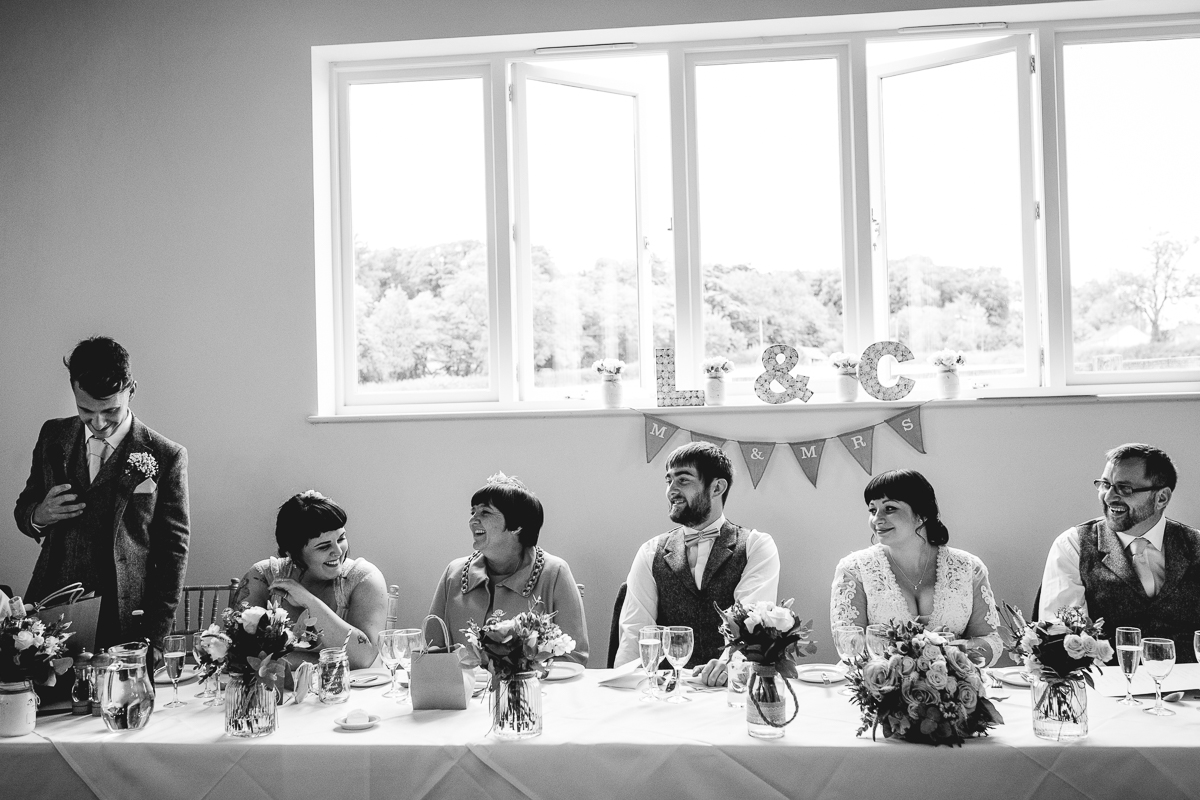 Best man gives speech at fun hyde barn wedding