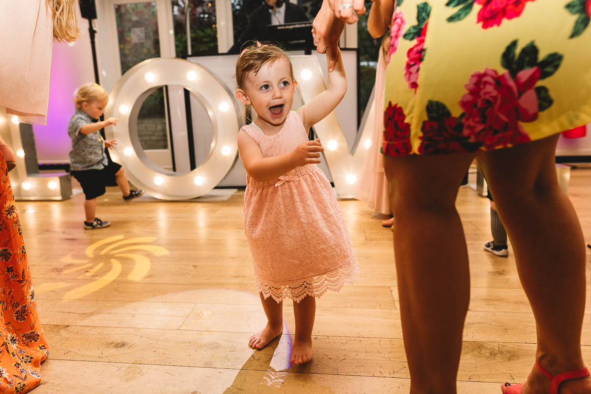 Fun photo of flower girl dancing