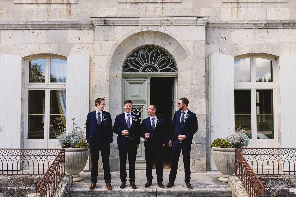 Groomsmen in blue suits at Chateau Lasfargues france destination wedding