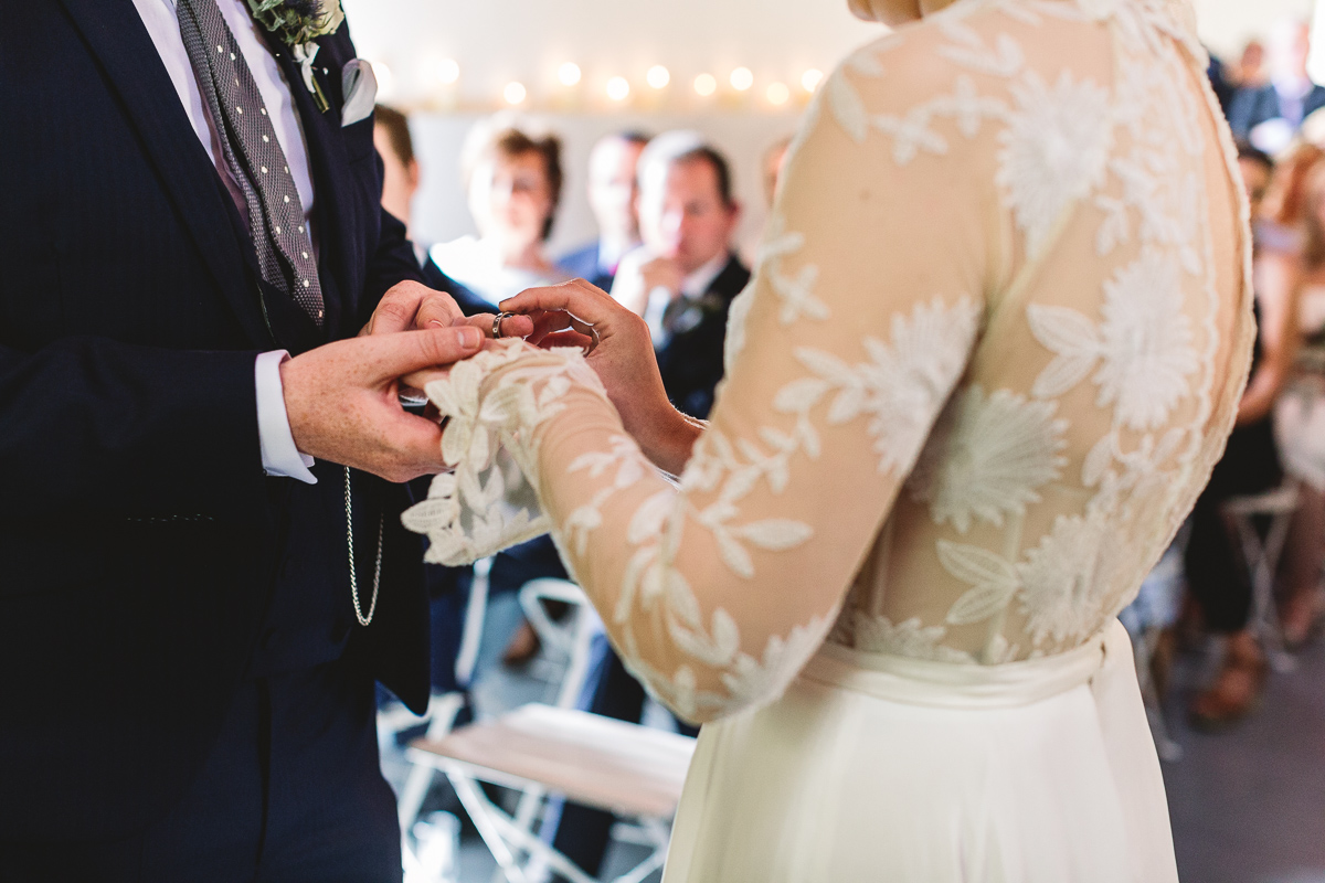 Bride in a Rue De Seine dress in rustic wedding ceremony in france