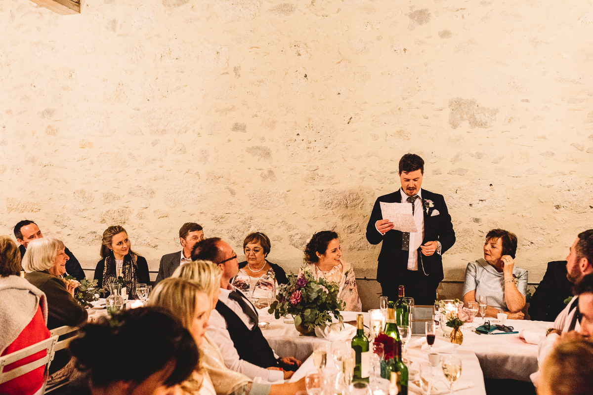 Groom wedding speech at rustic destination wedding in france