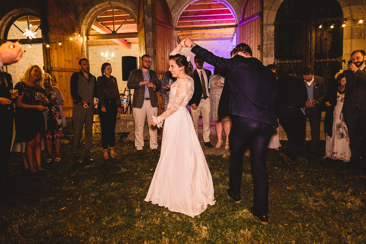 Outdoor first dance at chateau wedding in france with a bride in a Rue De Seine dress