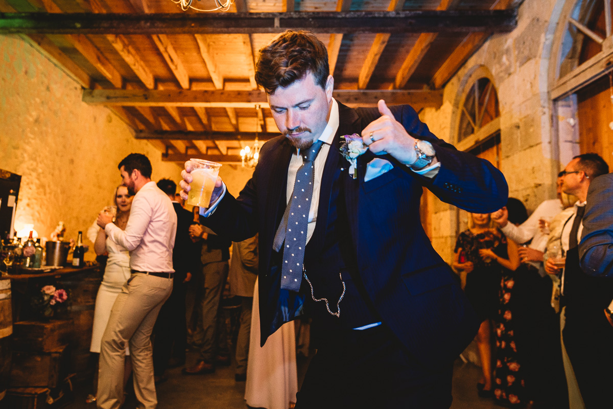 Fun groom dances at french chateau wedding