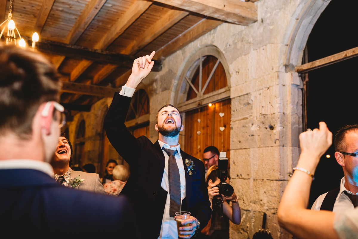 Fun best man dancing at chateau wedding