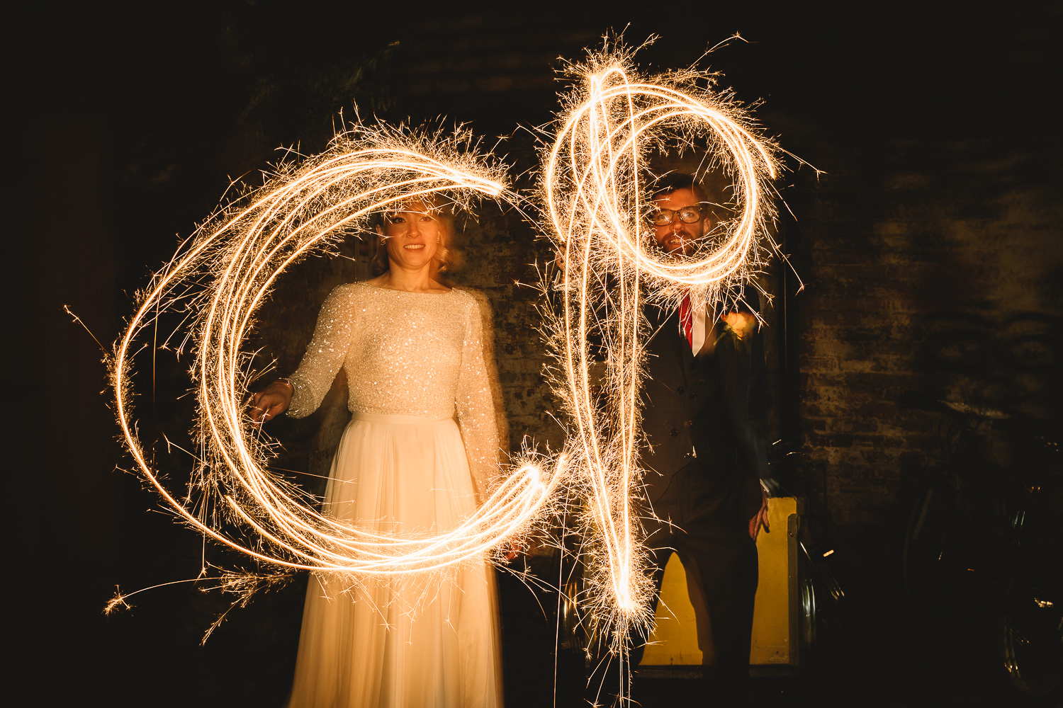 Long exposure couple alternative wedding portrait with sparklers