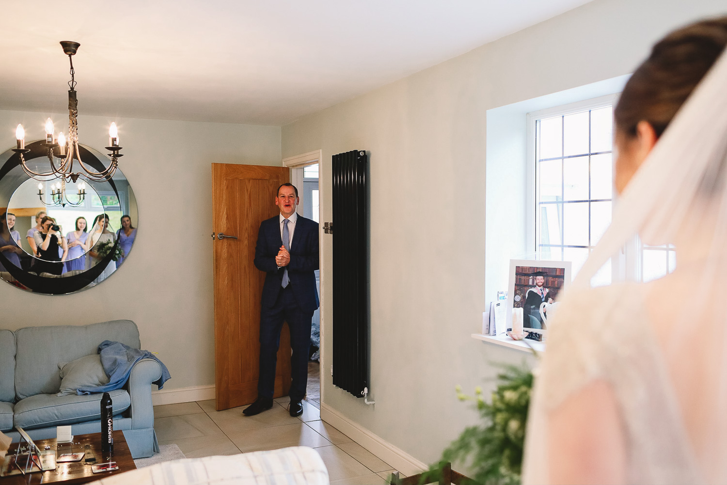 Dad sees bride for the first time and has the most happy and emotional look on his face as he walks in the room at relaxed Sheffield wedding
