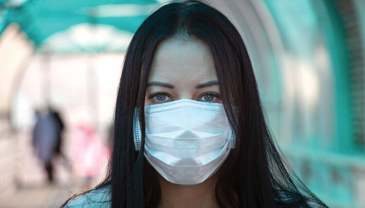 image of a person wearing a mask during a pandemic. This image is here to motivate the pandemic example we will cover in class.