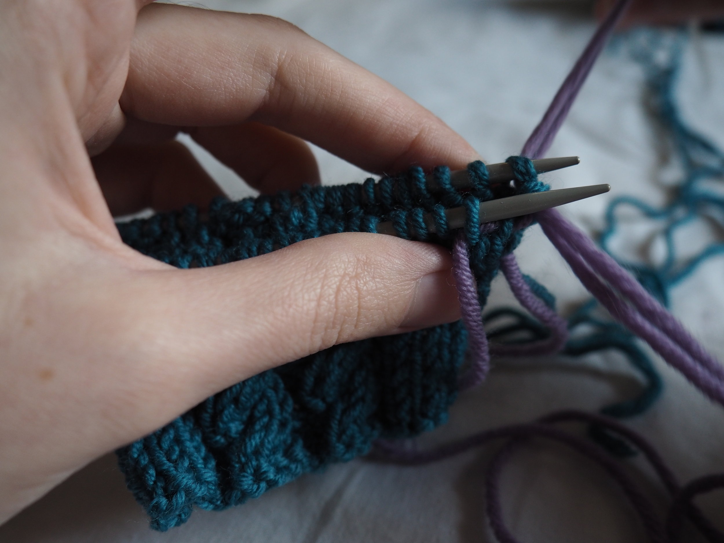 thread the yarn knitwise into the 2nd stitch.