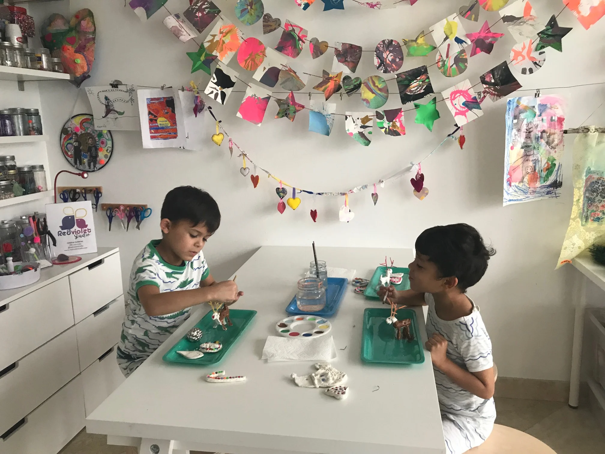 My boys at our home art studio working on some clay Christmas ornaments.