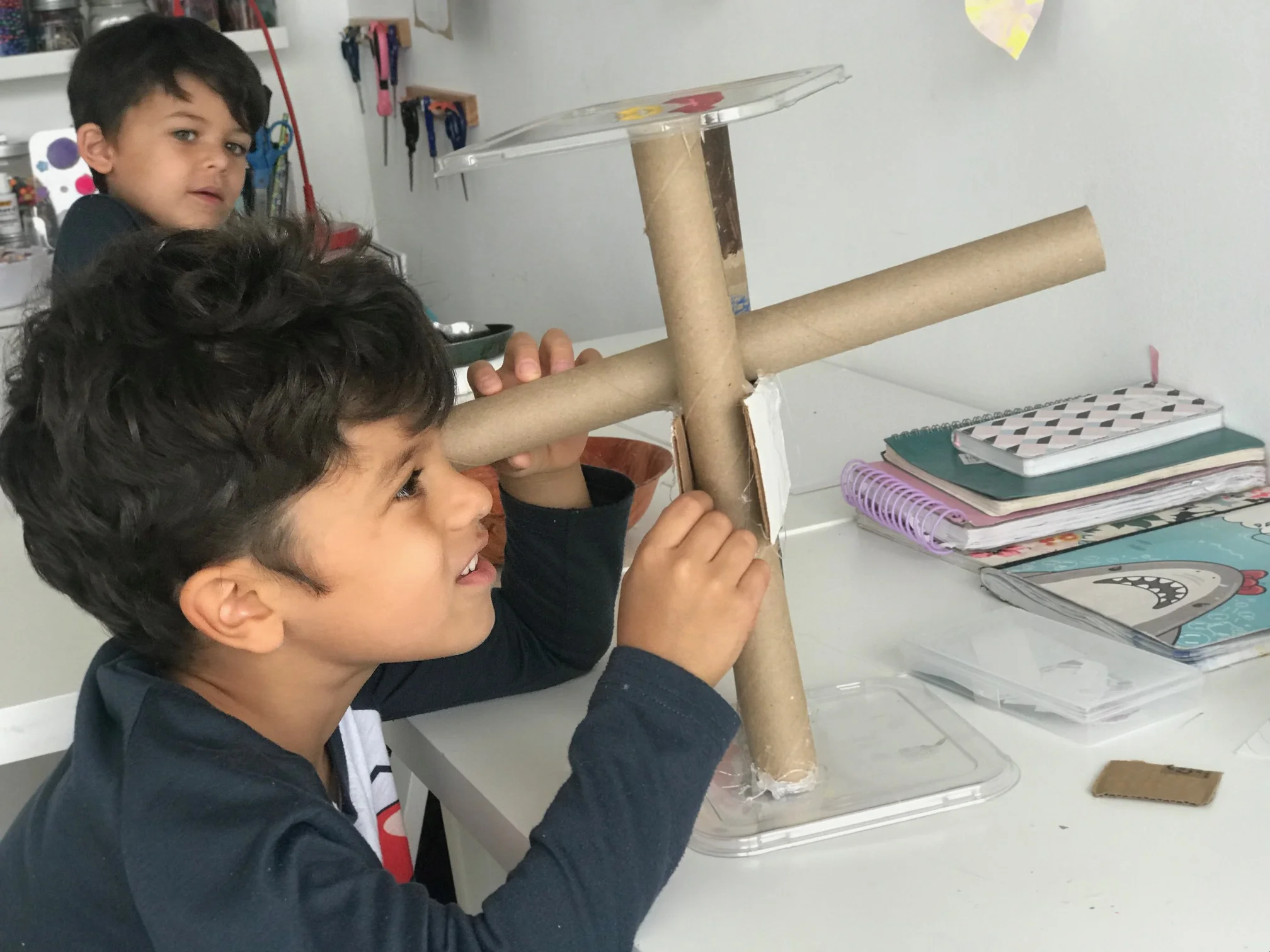 Manolo building a telescope on a Sunday morning.