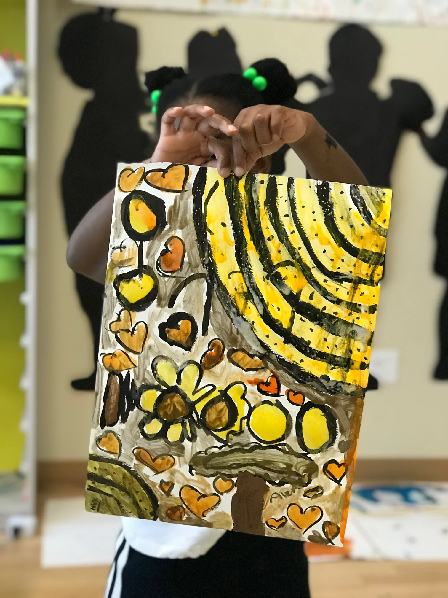 Alex (7) and her finished painting.