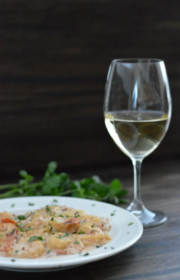 Chipotle Cream Shrimp Paired with Albarino. This easy meal gets cooked up in 10 minutes! Make it spicy...or not. Serve over Rice | CaretoPair.com