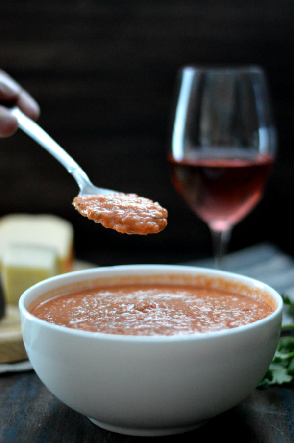 This homemade gazpacho is seriously the BEST I've ever had. Served with a glass of rosé wine and cheese plate, this makes an easy, relaxed summer meal |CaretoPair.com