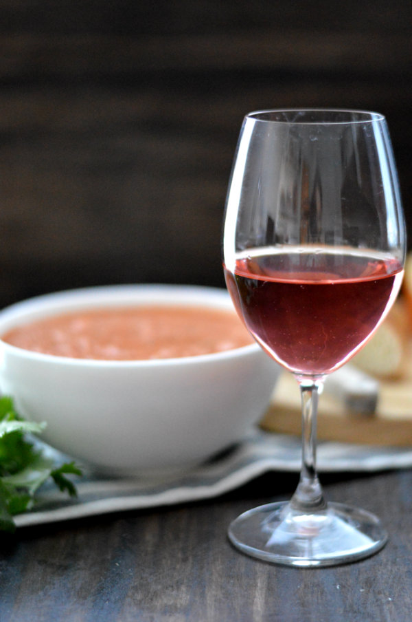 This homemade gazpacho is seriously the BEST I've ever had. Served with a glass of rosé wine and cheese plate, this makes an easy, relaxed summer meal |CaretoPair.com