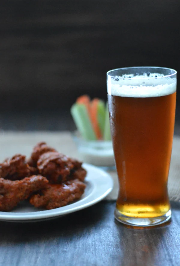 Here's a list of the best beers to pair with chicken wings! It may be an easy pairing, but some beers accentuate flavors more than others! via CaretoPair.com