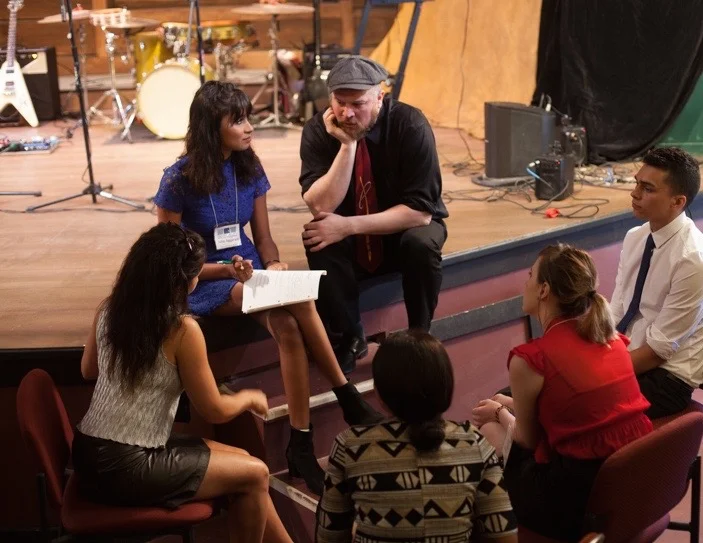 A team at a Face The Music leadership program event figures it out