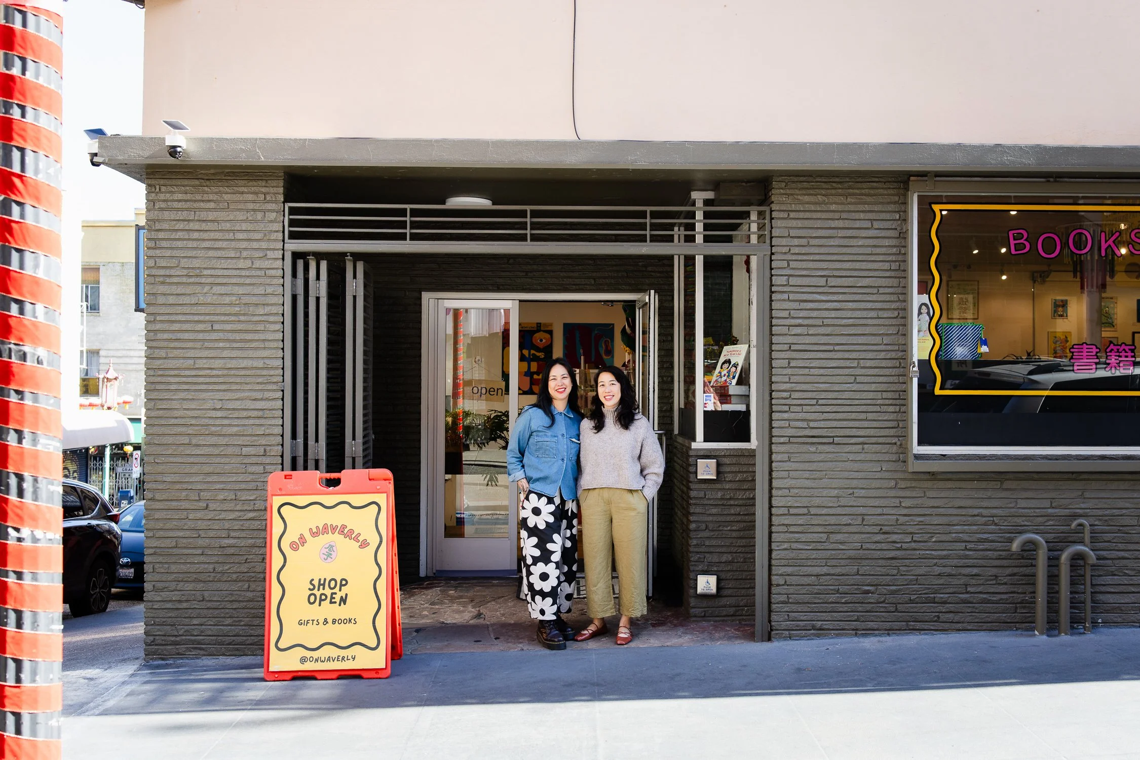 Two business owners standing outside their shop in San Francisco’s Chinatown, photographed for authentic brand photography