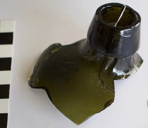Top of a gin bottle, found on the surface when clearing an access path during Season One.