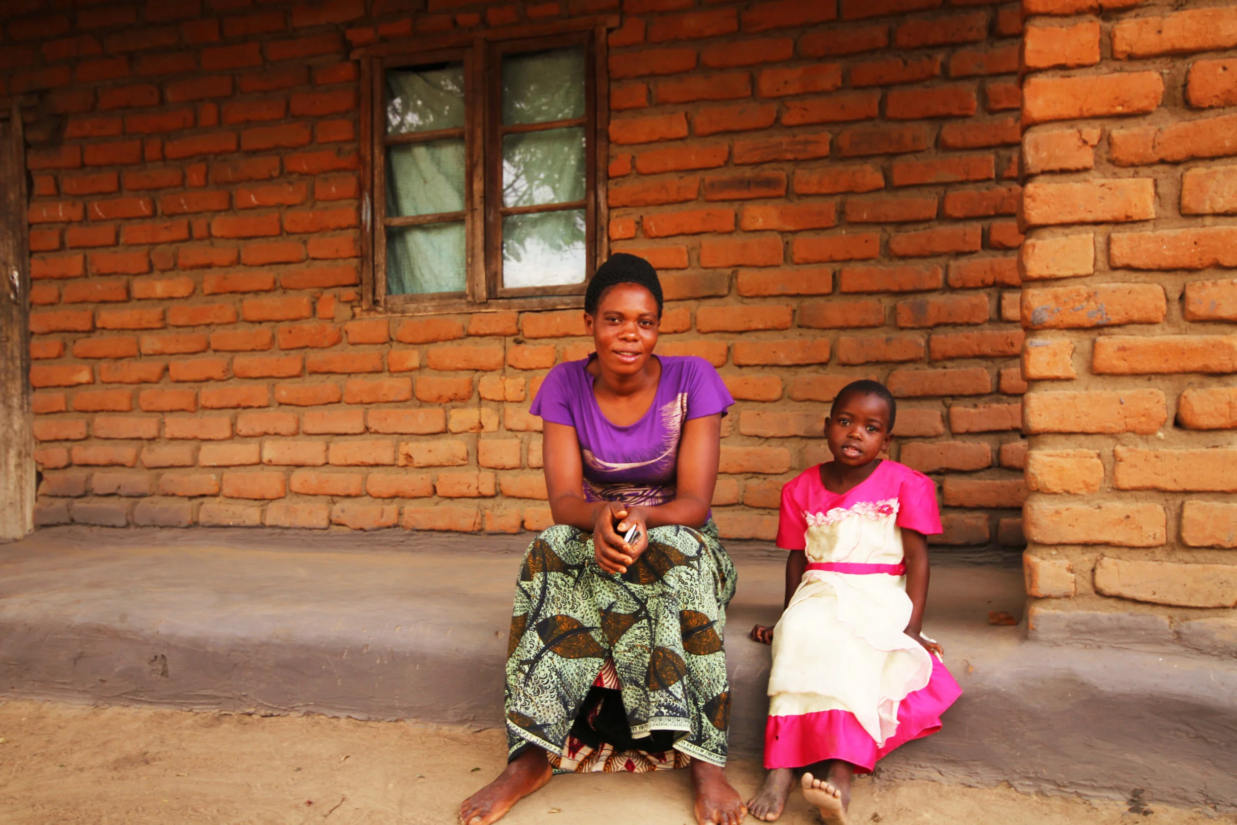 Enelsi and her family in Kasungu