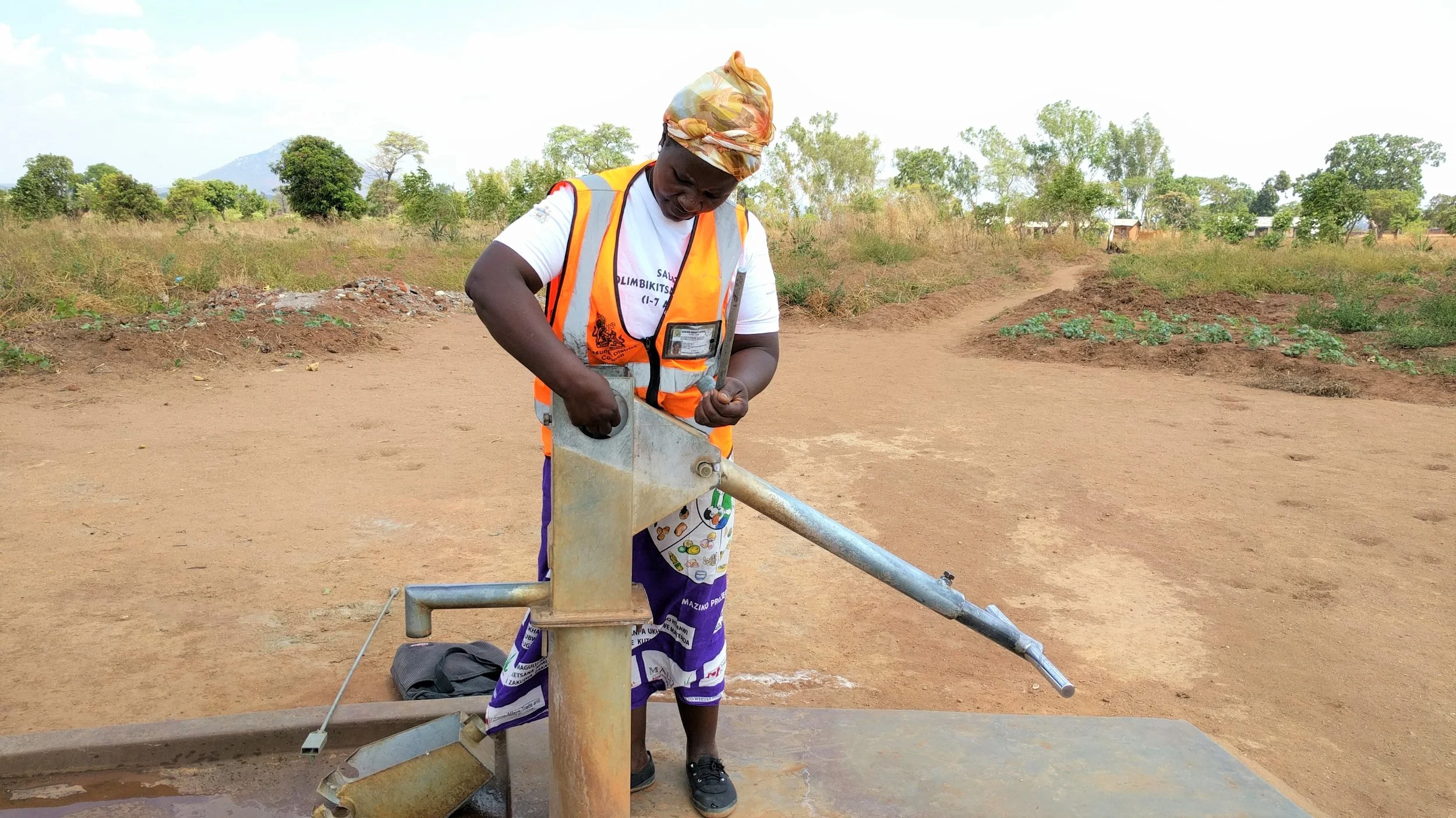 Maria Phiri fixing a broken community pump