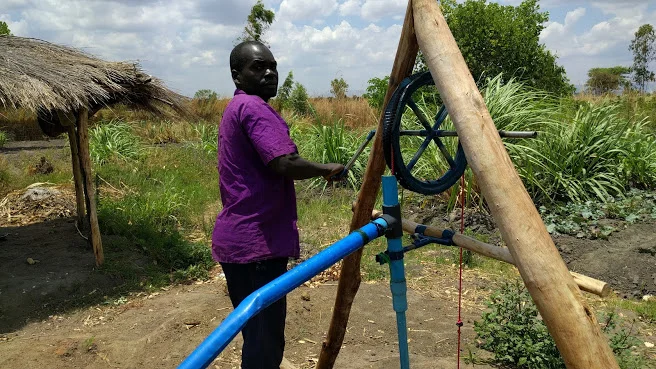 Kambale Makiyi with his irrigation pump.
