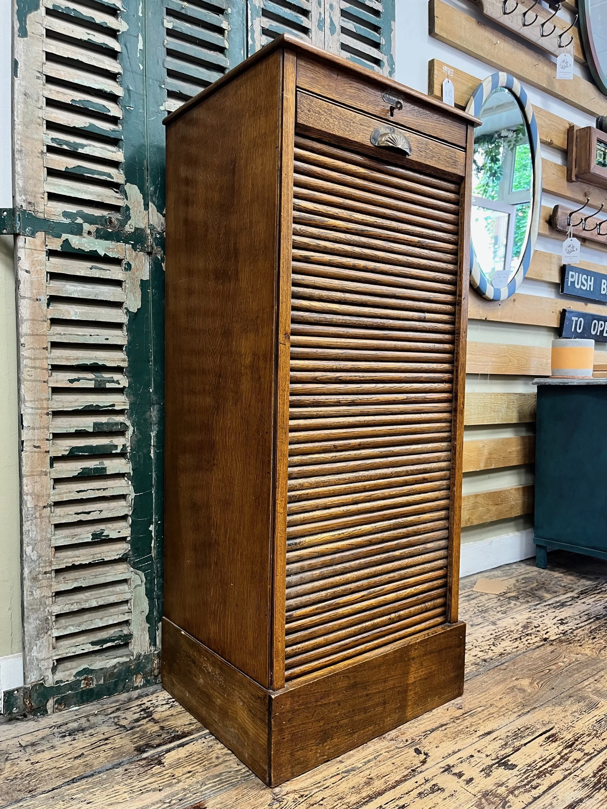 winterbearhome-shell-cup-handle-tambour-cabinet.jpg