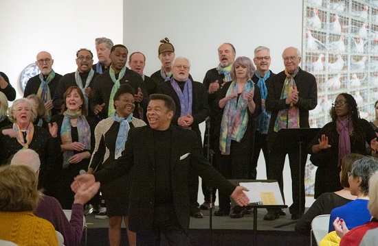 The Mill City Singers performed in their signature hand painted scarves. Photo by Ric Rosow