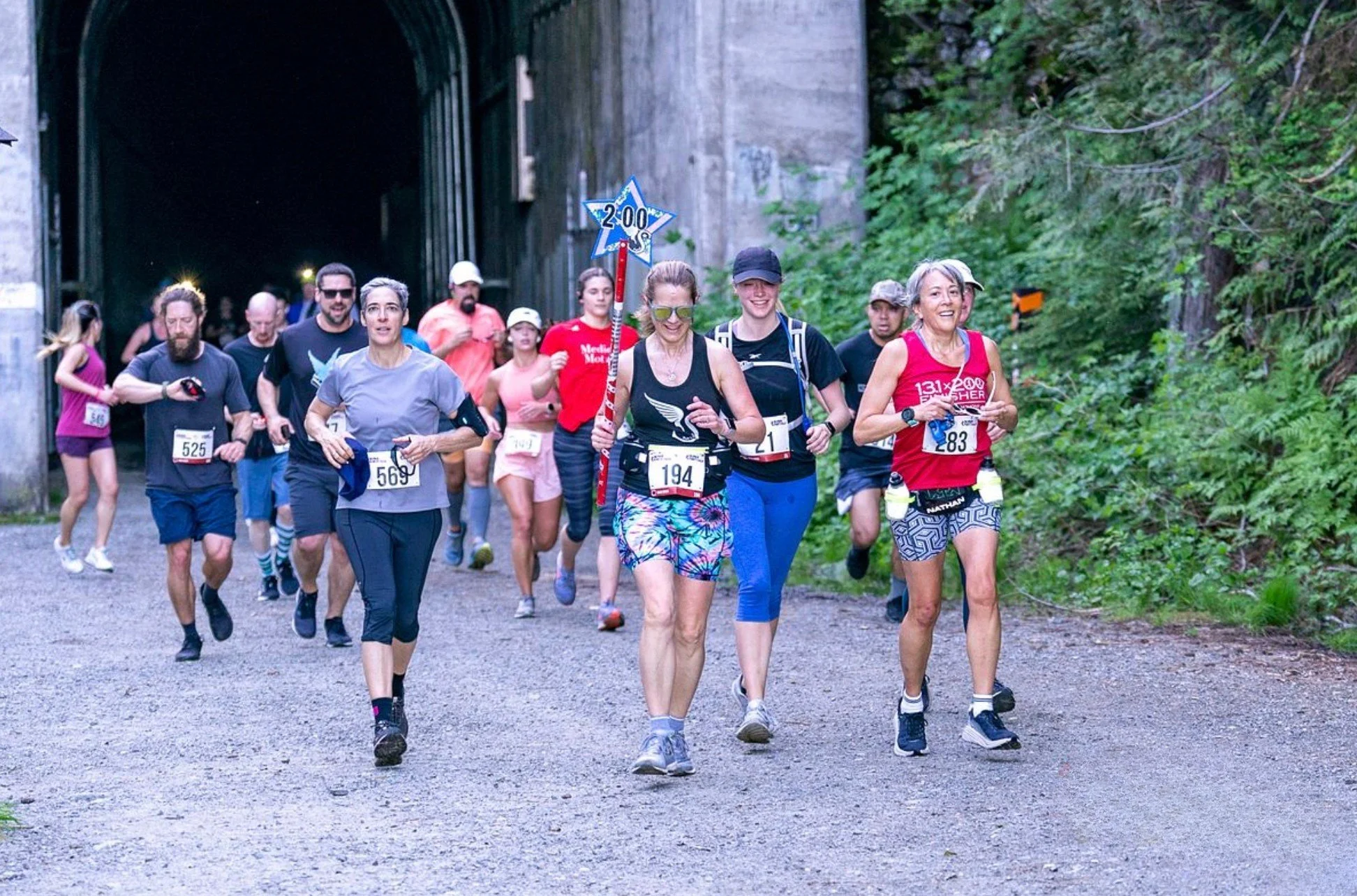 downhill marathon runners Washington Boston Qualifier marathon course Snoqualmie Pass marathon Pacific Northwest trail marathon pacers exiting tunnel