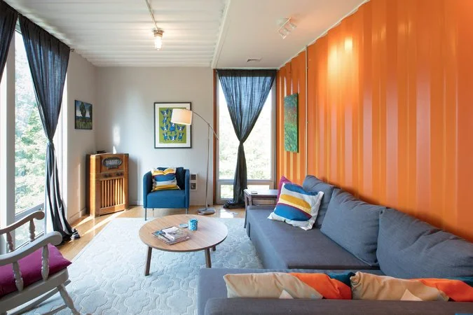 The living room in Robyn Volker and Anke Irmscher’s home. CreditPreston Schlebusch for The New York Times