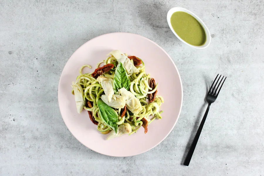  Zucchini Noodles with Brazil Nut Pesto, Artichoke, and Sun-dried Tomatoes. 