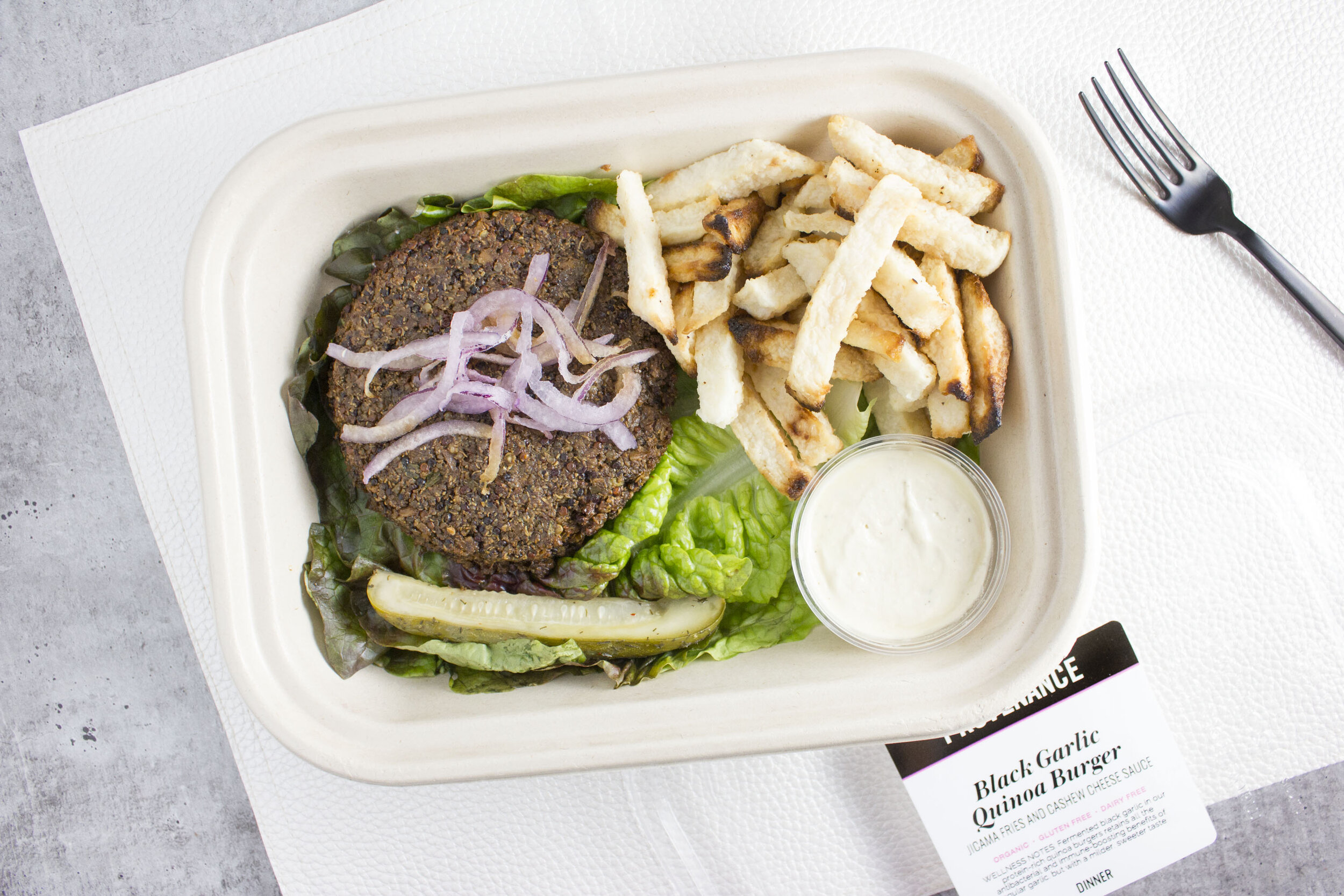 Black Garlic Quinoa Burger with Jicama Fries and Cashew Cheese Sauce 