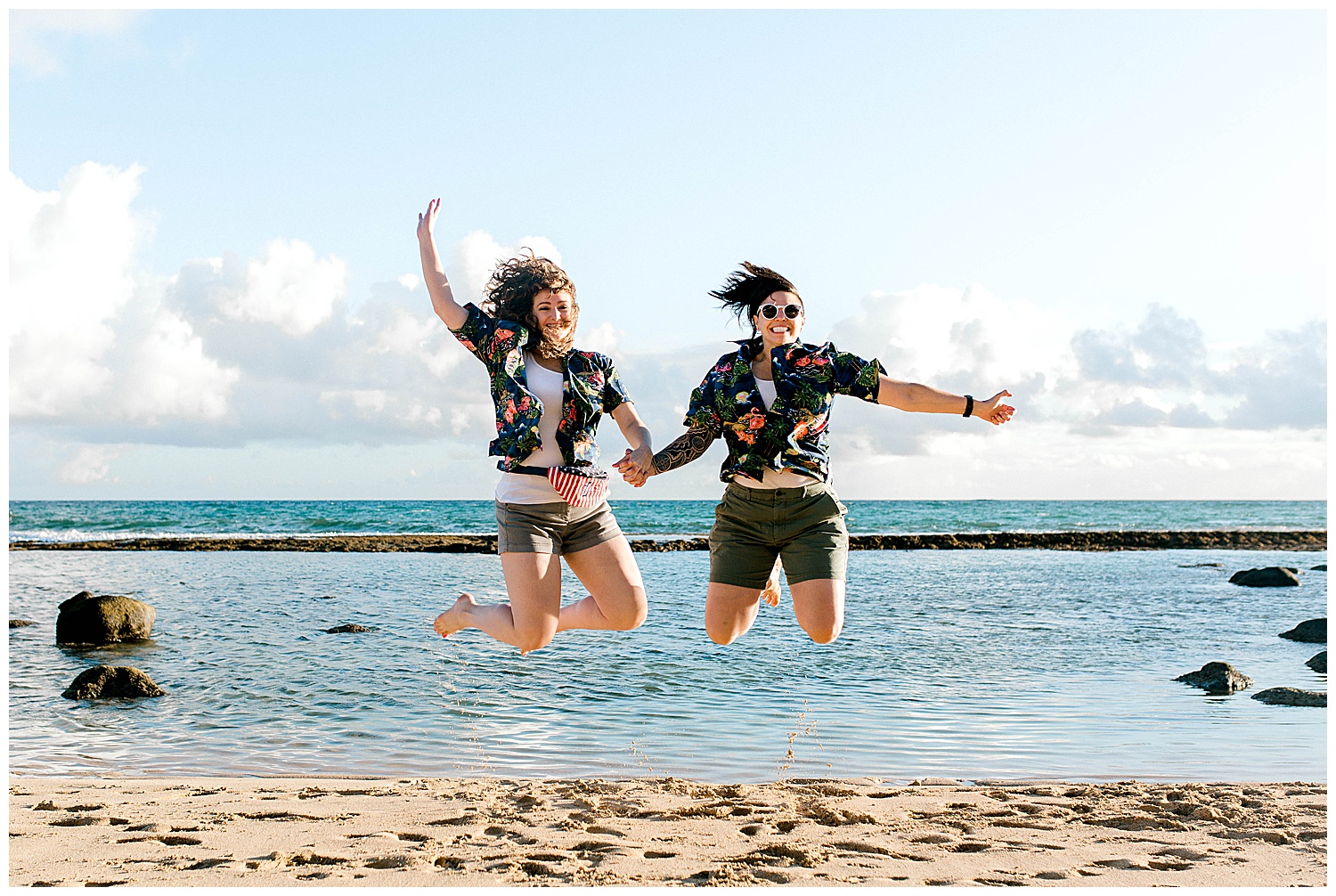 Couple jumping on Baldwin Beach
