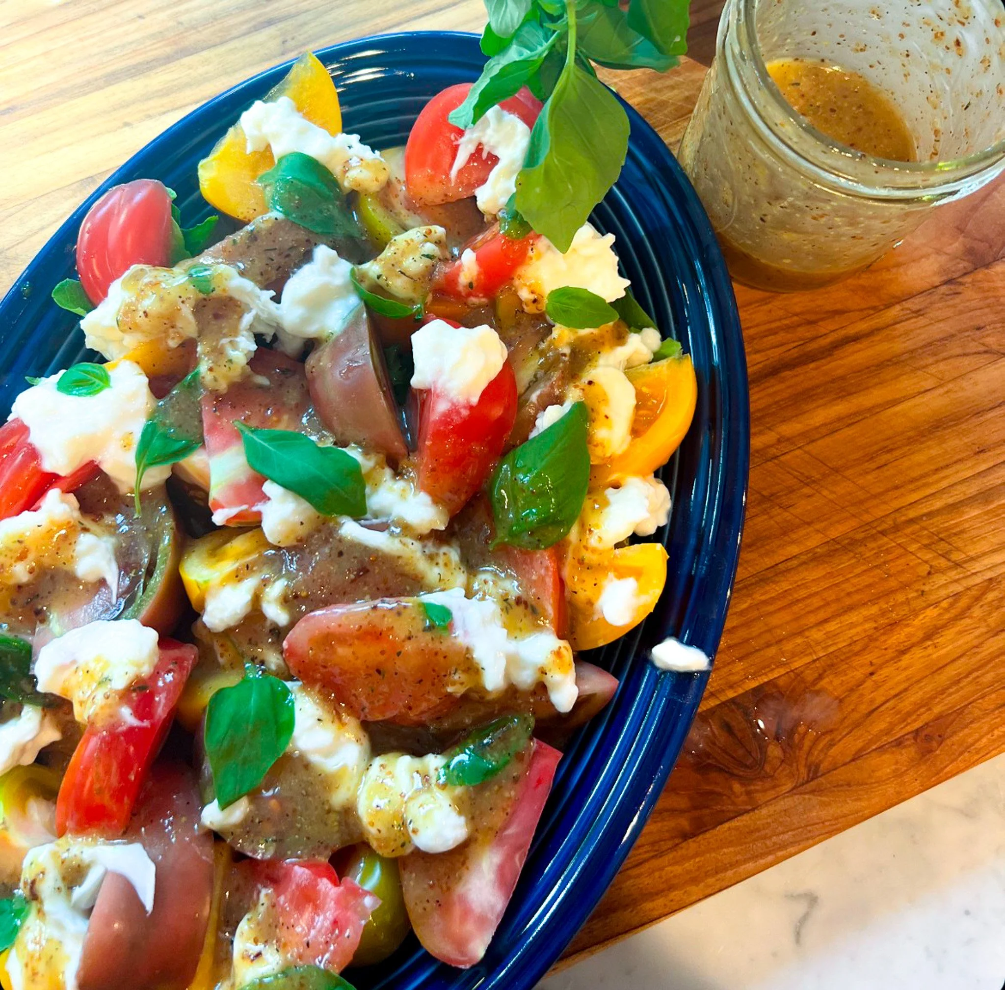heirloom tomatoes with stracciatella and roasted shallot vin