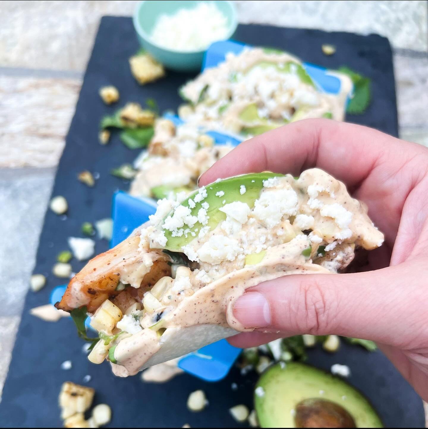 Grilled shrimp elote tacos...

Ingredients:

1 lb 16-20 shrimp, peeled and deveined
3 cloves minced garlic
1/2 c avocado oil
juice and zest of 1 lime
1 t chili powder
1 t salt
jicama tortillas
avocado, peeled, pitted and sliced
corn salsa
elote chees