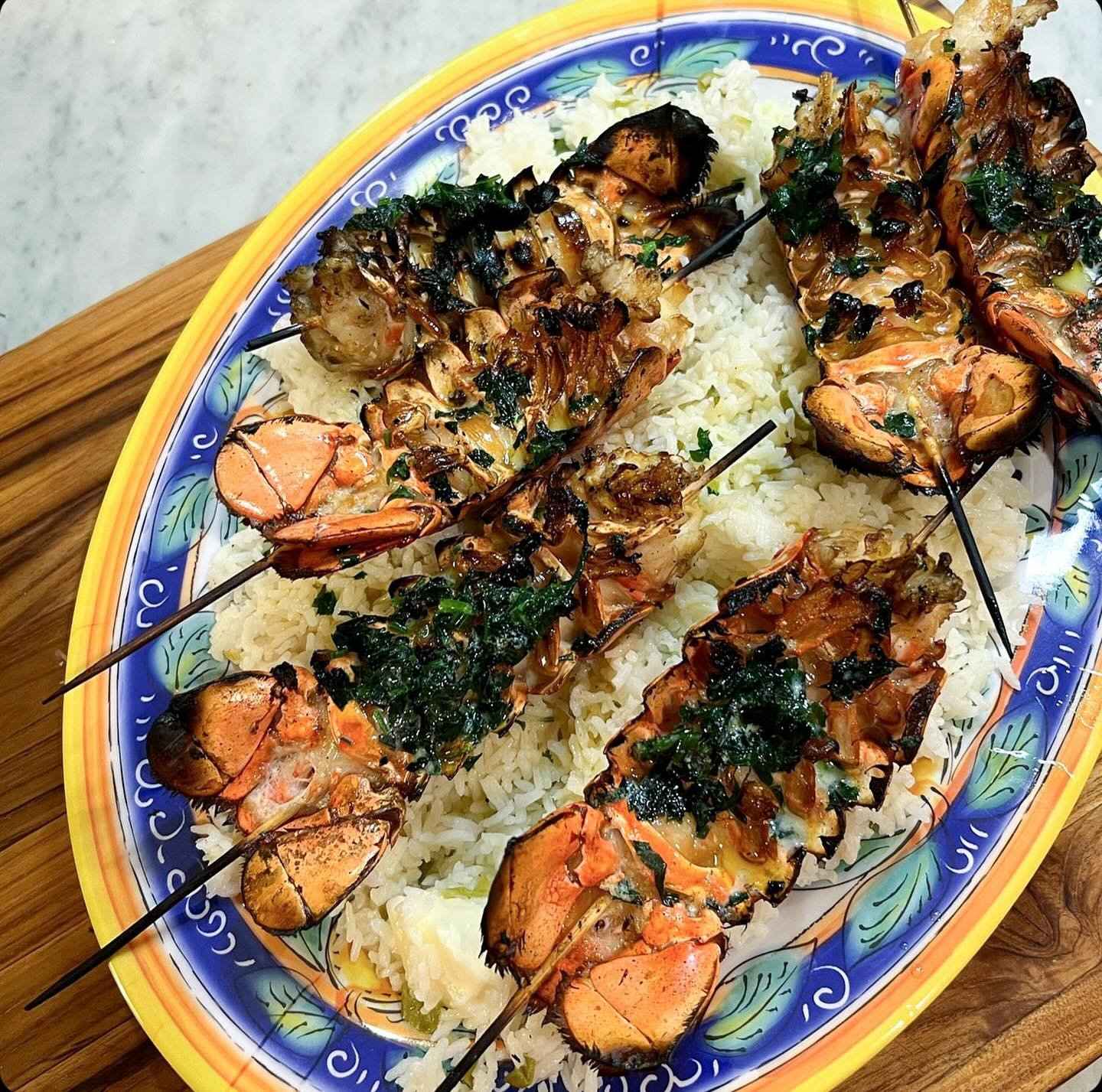 When national lobster day falls on Father's Day, you best believe we're grilling up some tails...

Ingredients:

6 lobster tails, defrosted
1/2 c evoo
3 cloves garlic, minced
1/2 c melted butter
handful italian parsley
zest of 1/2 lemon

Directions:
