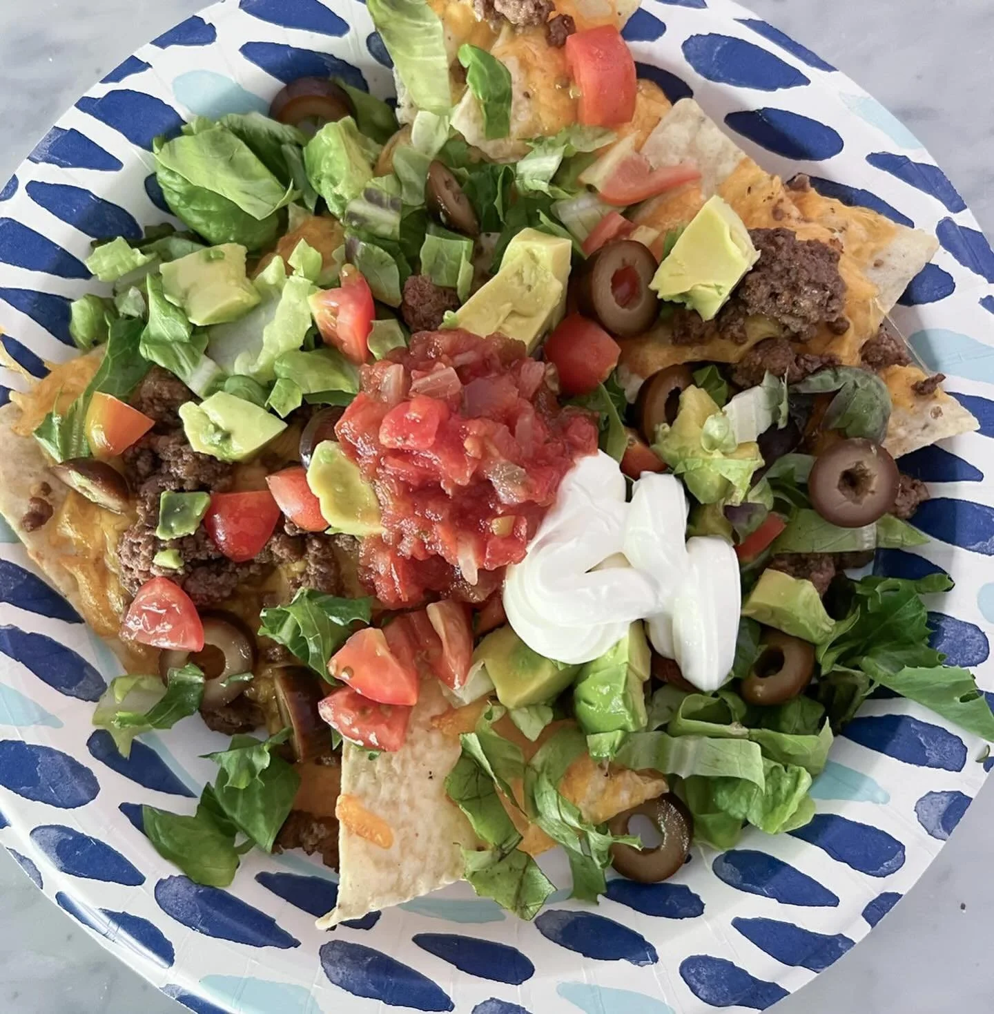Seeing as how Thursday is national nacho day; do yourself a favor and make some tacos tonight so you can use whatever is left to make these quick and easy leftover lunch nachos in ya airfryer.

Preheat your air fryer to 390. 
Spray inside with avocad