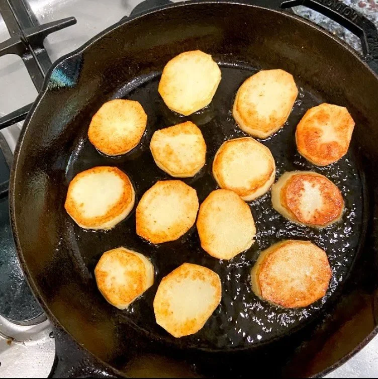 Continuing my goal of not spending Christmas in the kitchen are these buttered potatoes which can be made ahead on the stovetop and thrown in the oven just before serving...

Ingredients:

5 golden potatoes, peeled, tops and bottoms removed, and slic