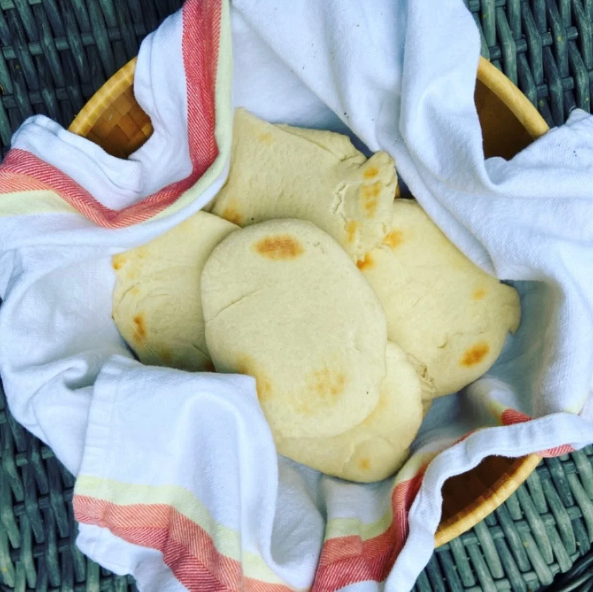 Yes please, to homemade pita...

Ingredients:

1 pack active dry yeast
1 t sugar
1/4 c lukewarm water
3/4 c lukewarm water
1 t salt
3 c all purpose flour

Directions:

Whisk together yeast, sugar, and 1/4 c water. Cover and let yeast bloom. About 10 