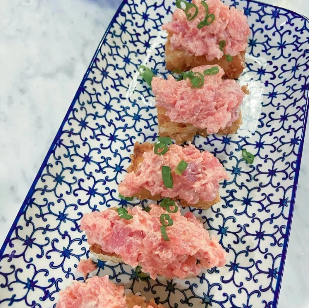 Spicy tuna crispy rice... the stay-at-home version

Ingredients:

sushi rice
avocado oil
1/2 lb sashimi grade ahi
2 T kewpie mayo
2 t siracha
2 green onions, sliced

Directions:

Press sushi rice into a parchment lined jelly roll pan about 1 inch thi