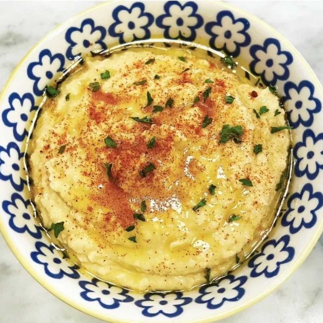 National hummus day... and here's my quick and easy version

Ingredients:

2 cans of organic garbanzo beans, rinsed and drained
juice of 3 lemons
3 large garlic cloves
1/2 c sesame oil
2 t sea salt

Directions: 

Place all ingredients in a food proce