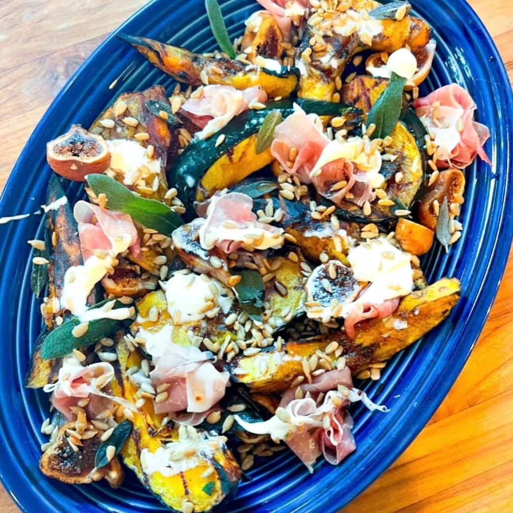 It's national acorn squash day... you're welcome.
And, you're also welcome to try this grilled acorn squash side complete with figs, prosciutto, crispy sage, and sunflower seeds all drizzled with cr&egrave;me fraiche, fig balsamic, and honey...

full