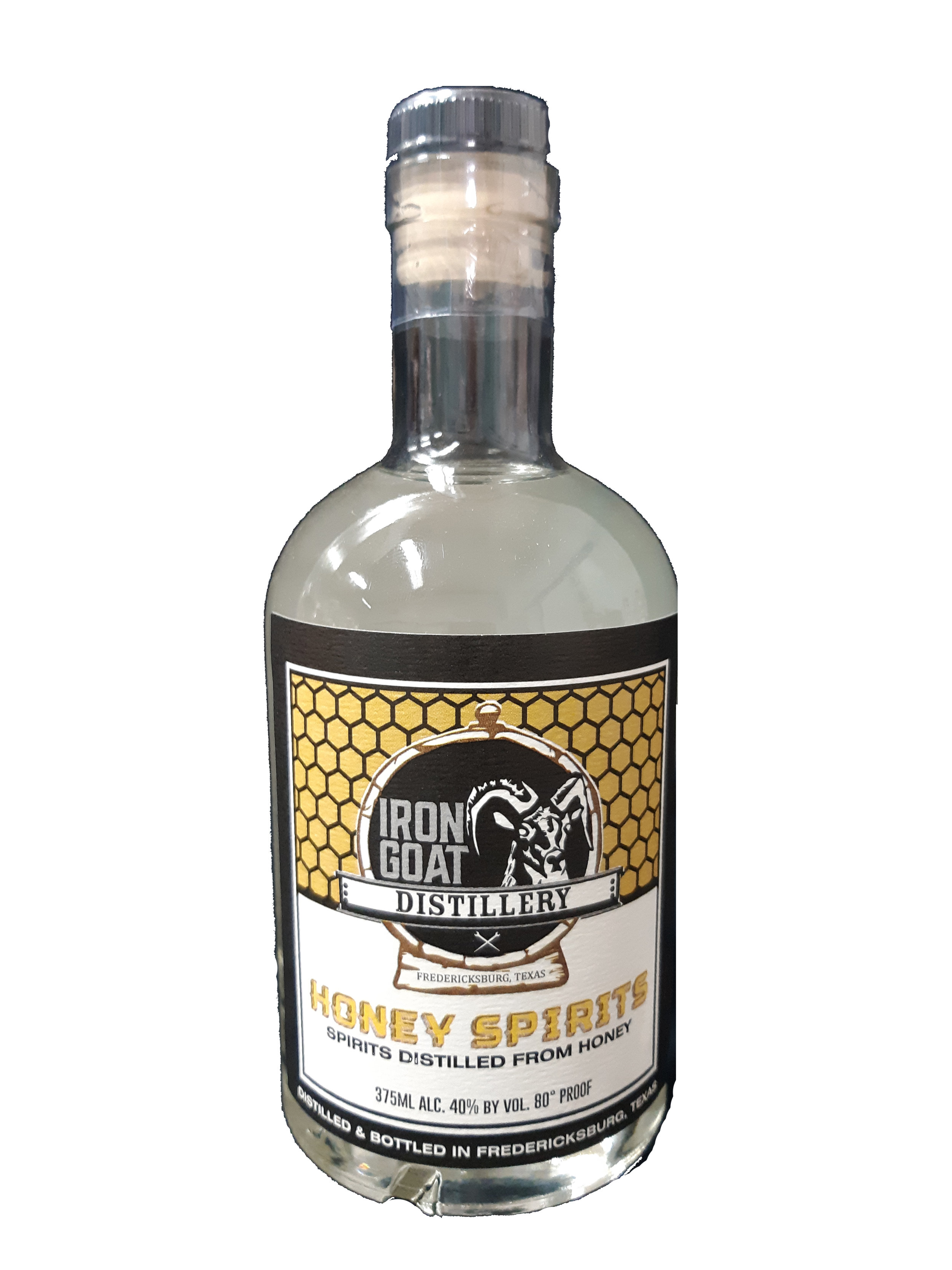 Bottle label for Iron Goat Distillery Honey Spirits, with a honey comb pattern, a black and white logo, and text indicating it is distilled in Fredericksburg, Texas with 40% alcohol by volume.