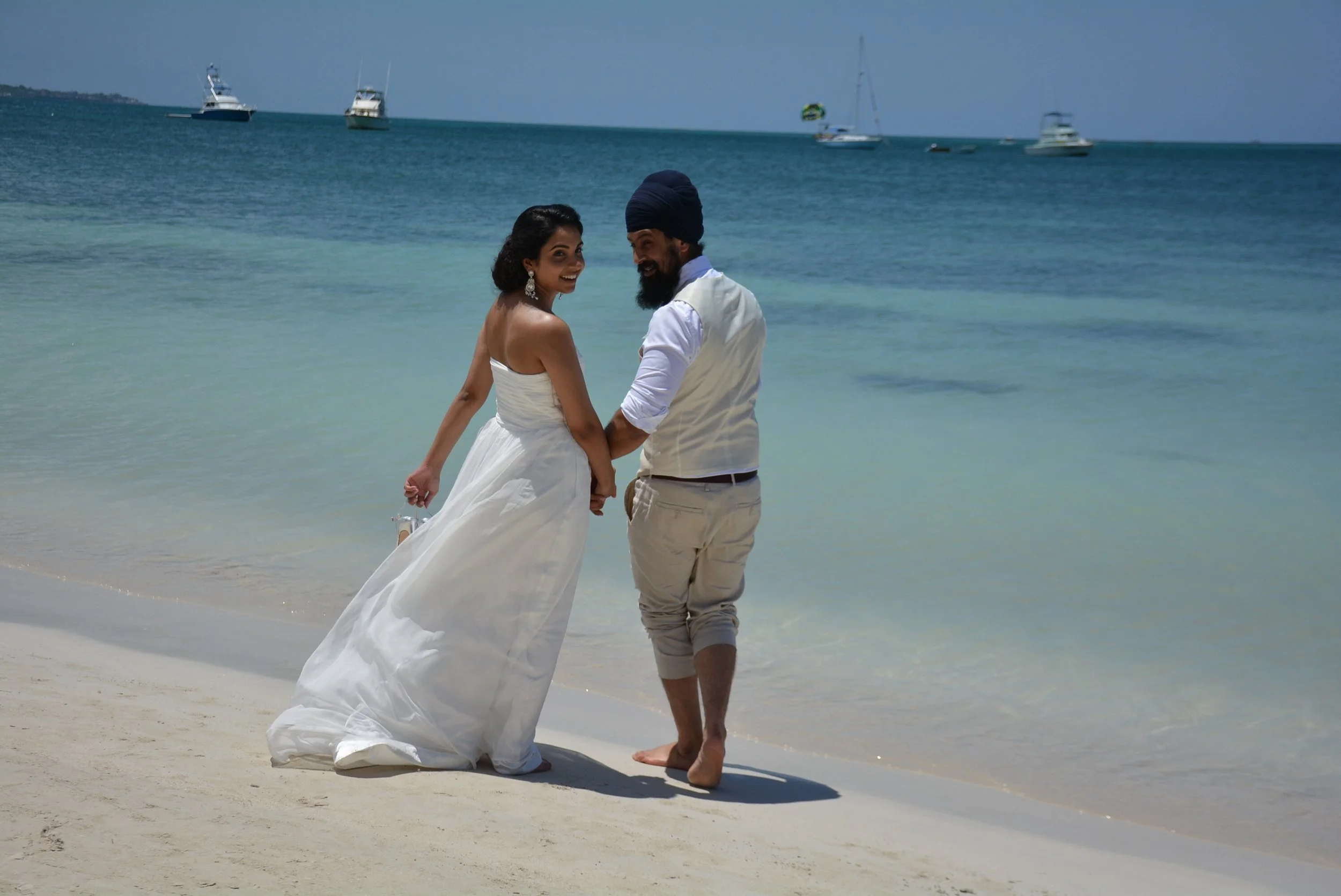 Post-wedding portrait session on the beach. Note to the ladies- keep that powder nearby, as the intense heat literally melted my makeup!