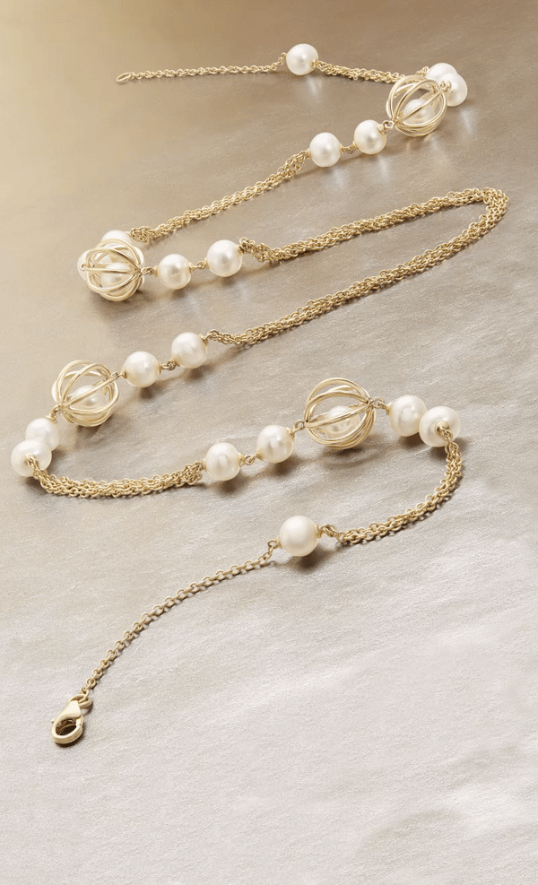 HONORA EMBRACE  PLOT TWIST. The classic white pearls in Honora Embrace are anything but predictable. Suspended from 14K Gold cages this collection has some serious edge.