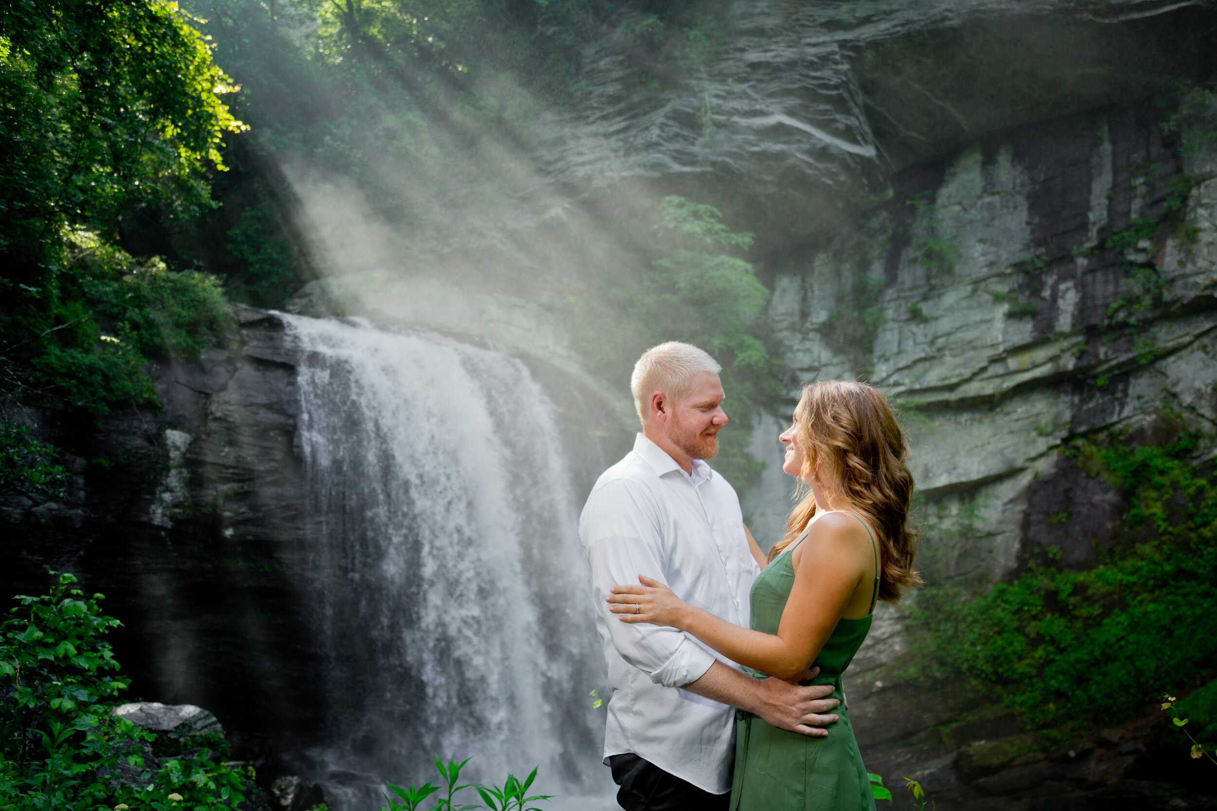 Sunlit mist at Looking Glass Falls Engagement Session