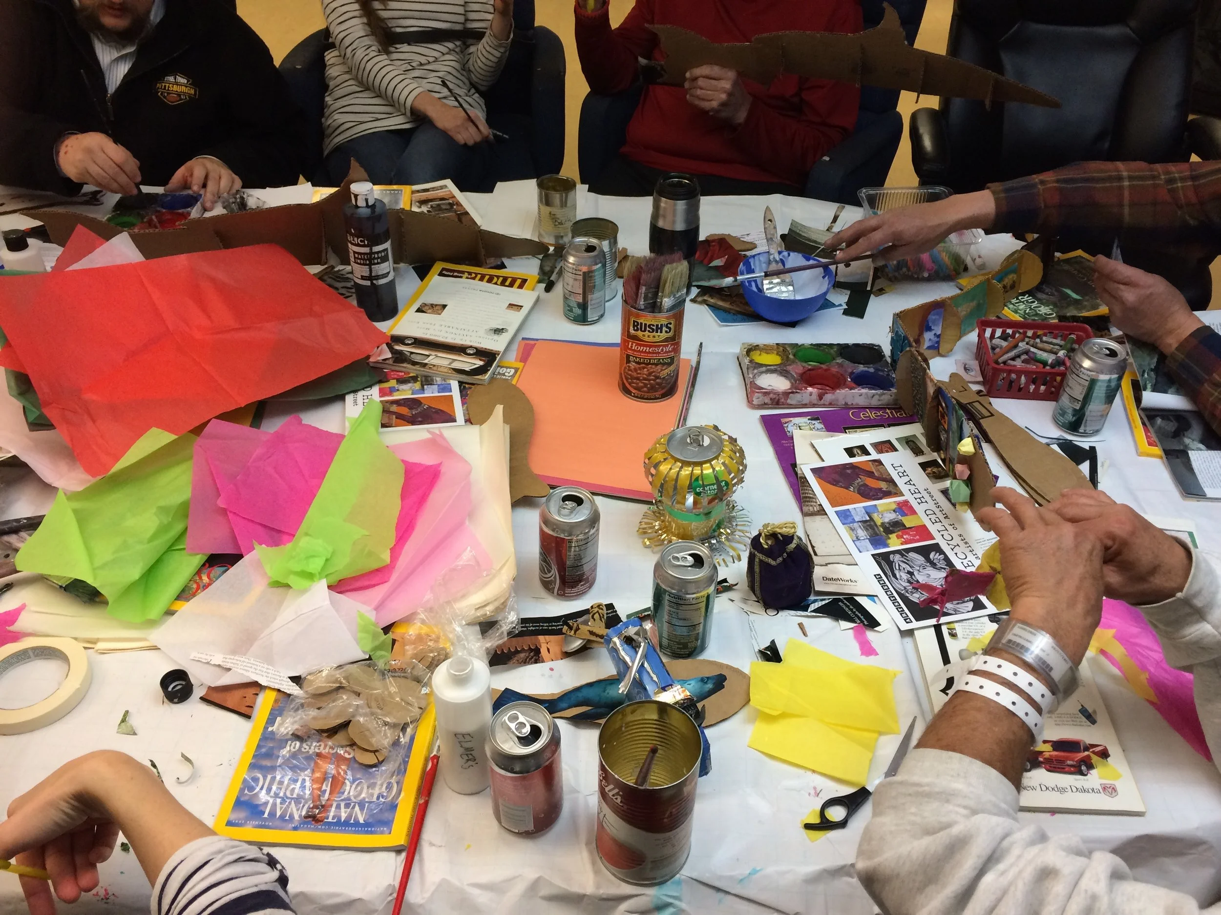 Participants at Heading Home create fish for Collective Memory.