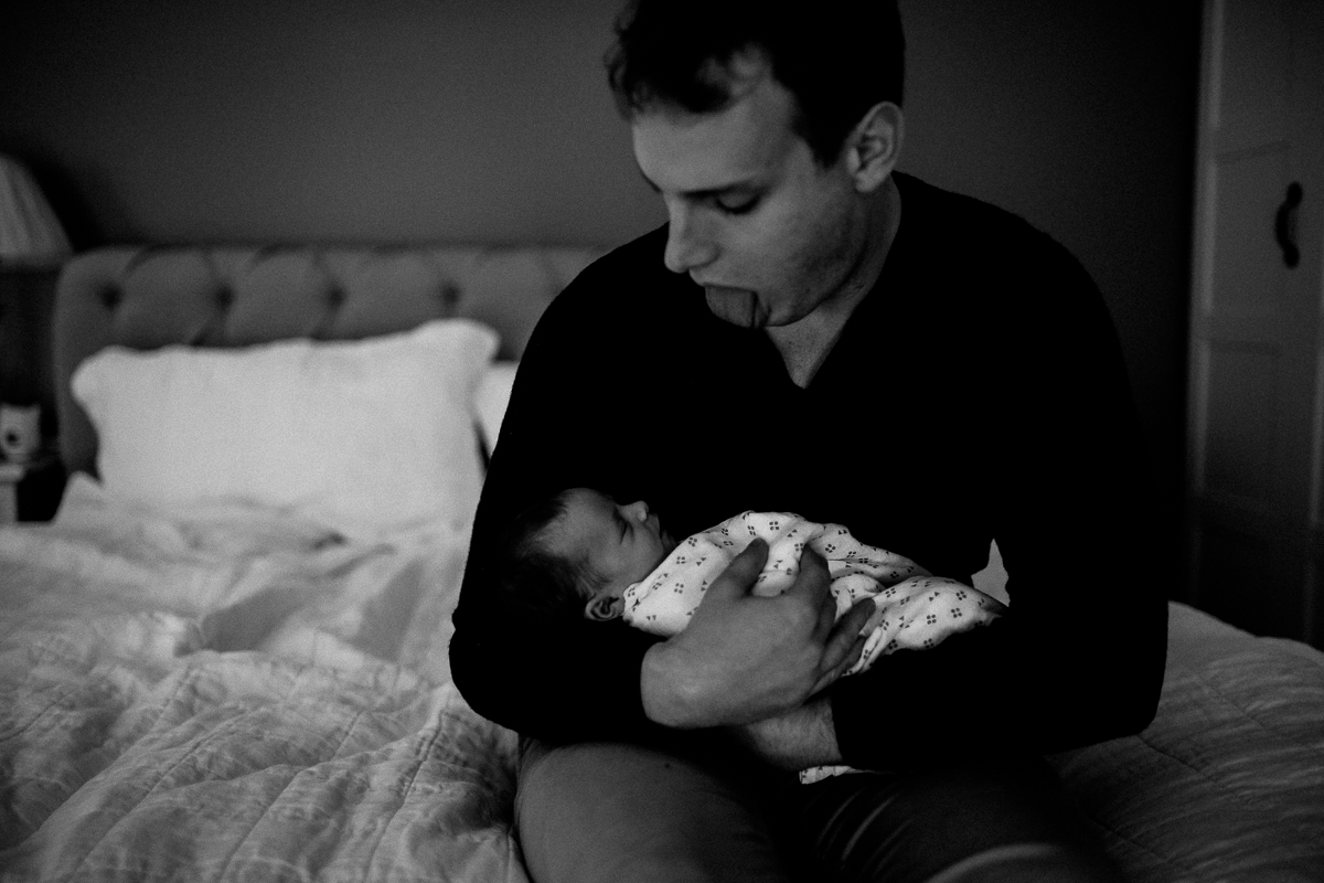 Cheeky Dad with his newborn