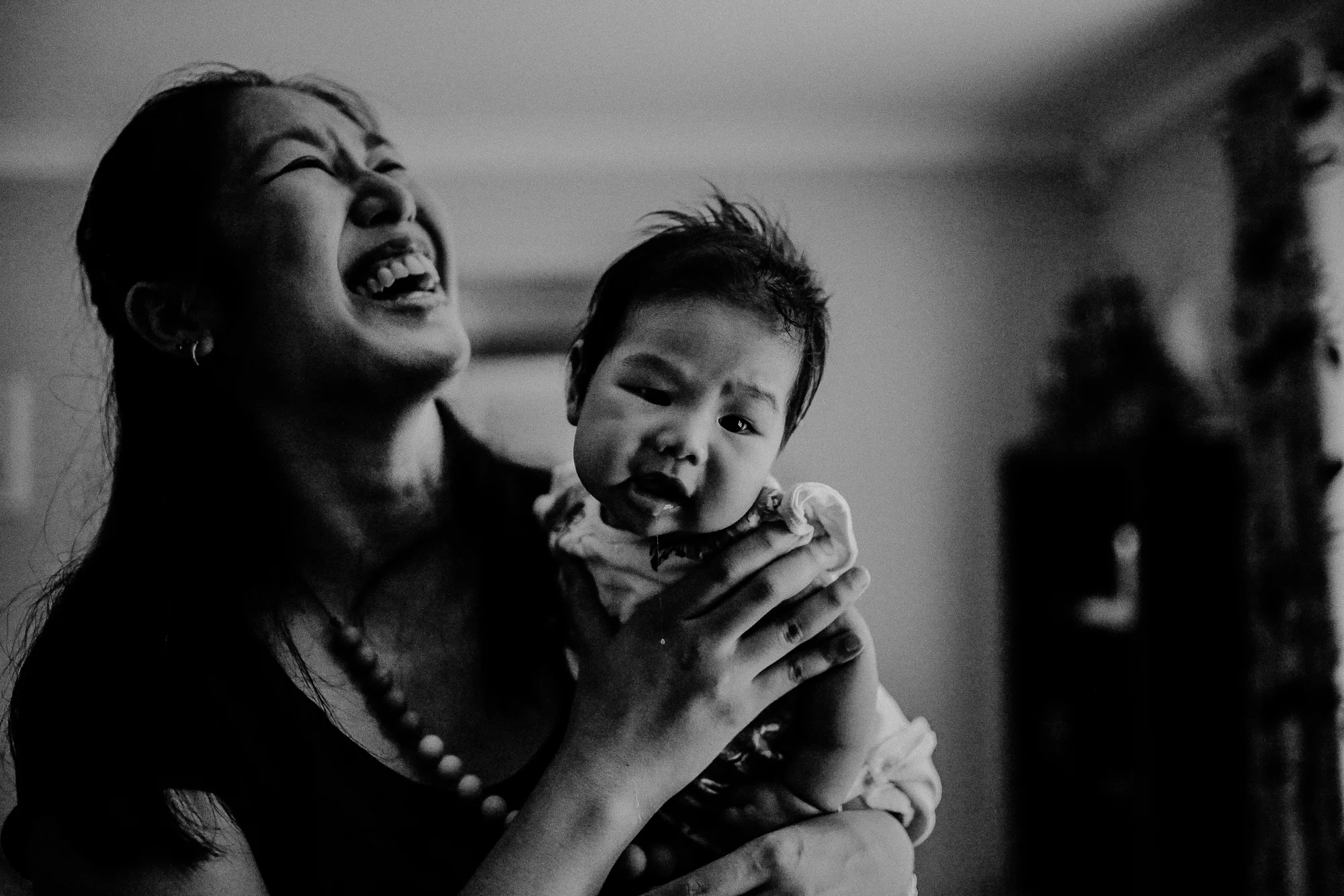 Jessamyn having a laugh with her newly smiling 4 month old Vivienne