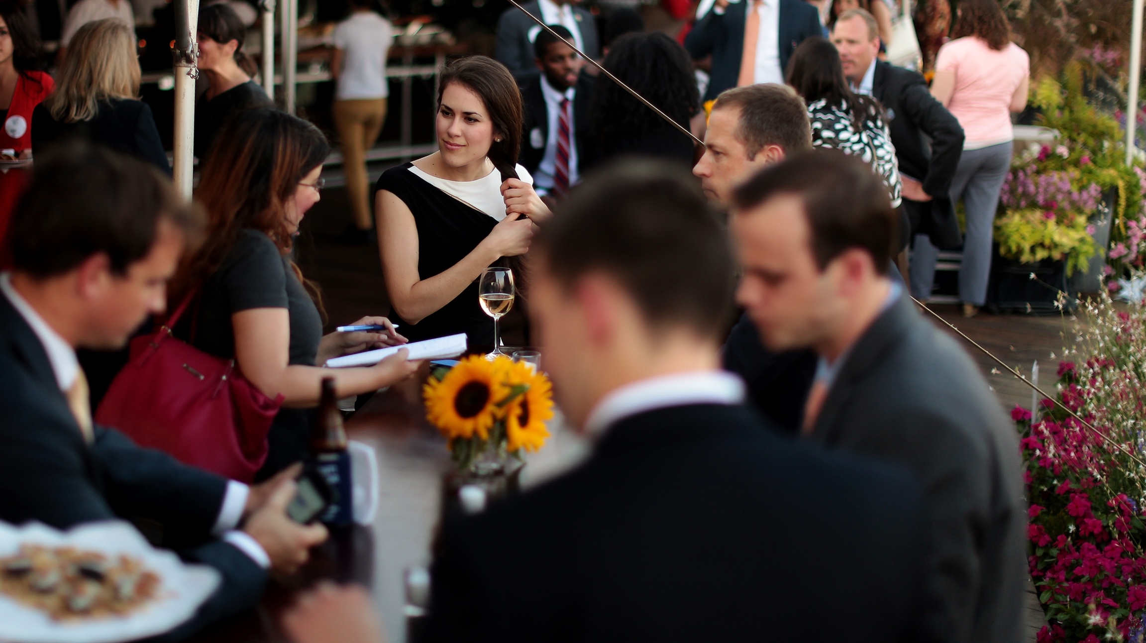 Event attendees socializing on the rooftop space